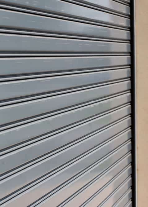 Steel garage door that looks like classic wood or vinyl doors