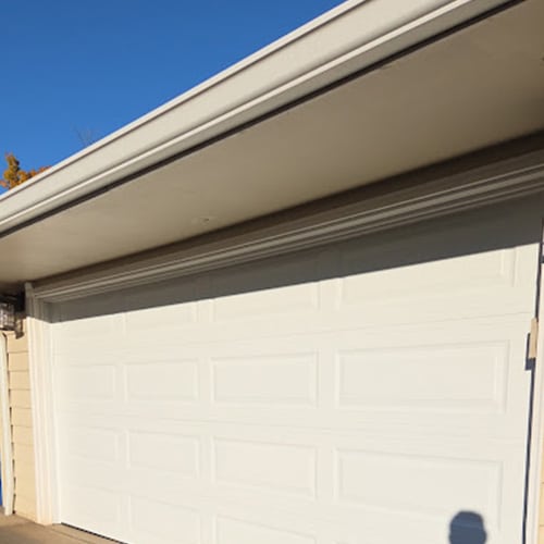 Cream colored garage door after service