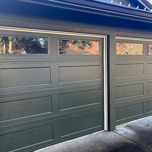 Cream colored garage door after service